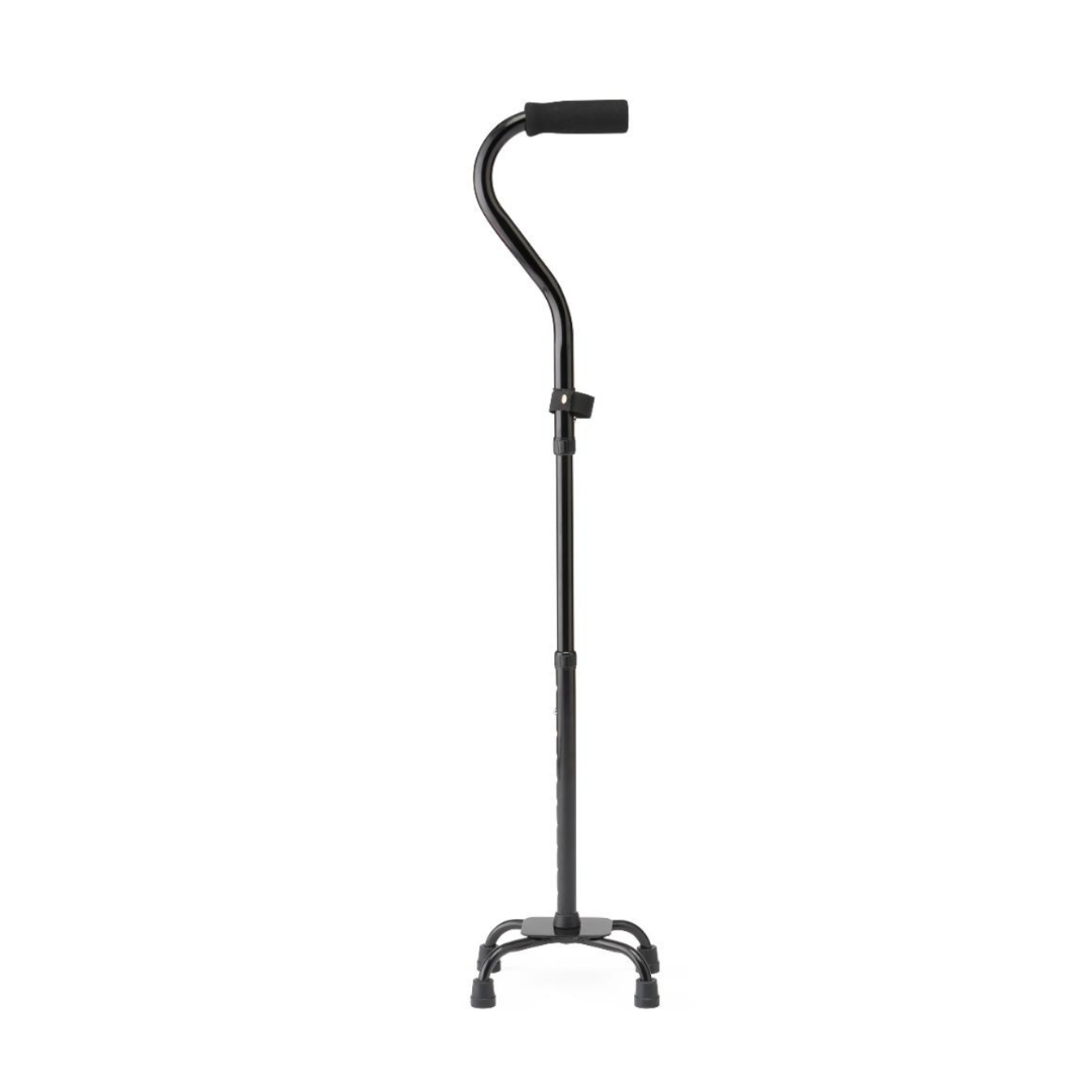 The Medline Folding Aluminum Quad Cane with Small Base, in black, features a cushioned handle and four skid-resistant rubber-tipped legs for stability and dependable support, shown standing upright against a plain white background.